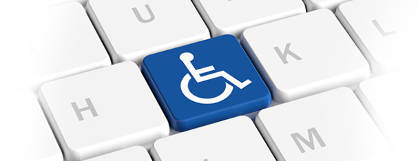 Zoom in view of a computer keyboard. The letter "J" is replaced with a key that is the handicap symbol.