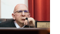 Photo of Justice Samour listening intently while serving on the bench.