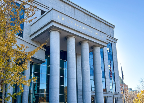 Colorado Supreme Court front of outside of building with pillars against blue sky